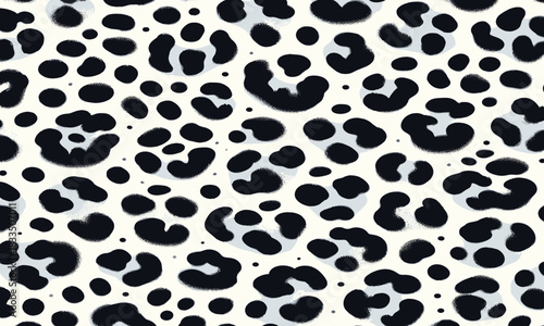 A seamless black and white animal print pattern representing leopard skin, creating a wild and stylish fur texture for backgrounds and design