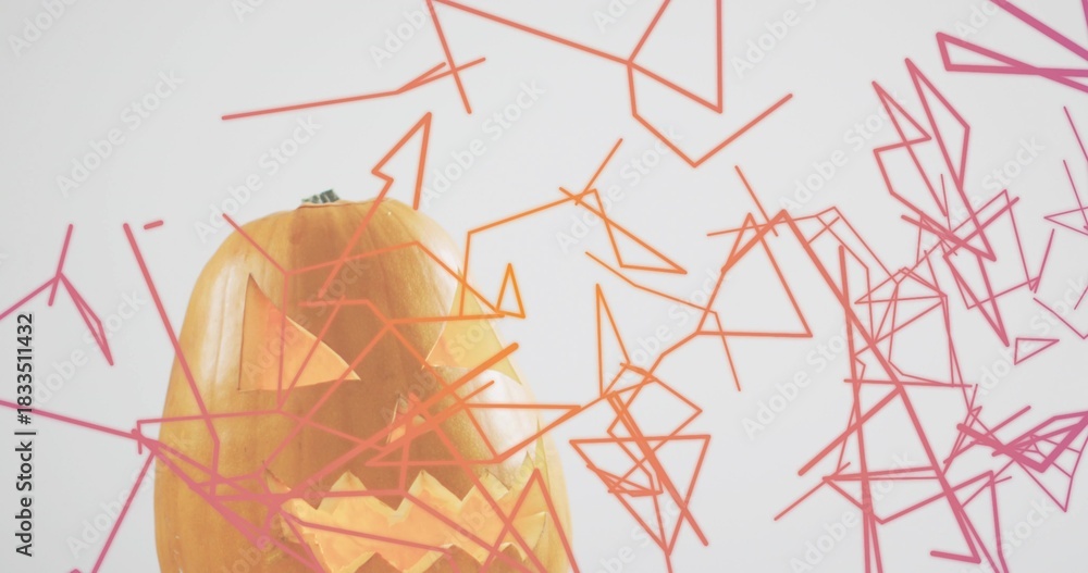 Naklejka premium Glowing carved pumpkin emitting warm light at studio with green stem, wireframe shapes, copy space