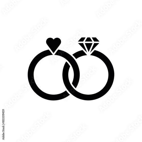 Two interlocking wedding rings one with a heart one with a diamond on a plain white background.