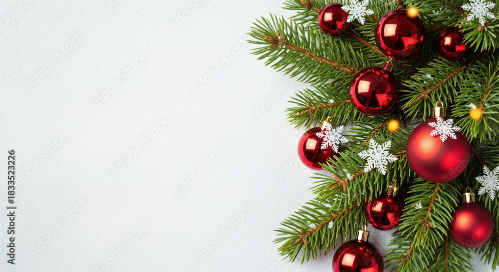 Fototapeta premium Christmas background with red baubles and fir branches on white snow. Festive holiday decoration flat lay with copy space. New Year greeting card border