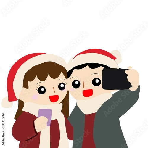 クリスマスのお祝いに自撮りをするカップル