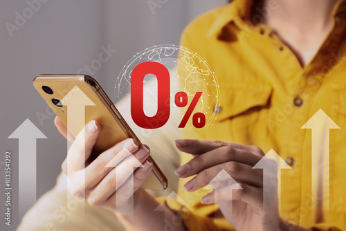 Woman using mobile phone indoors, closeup. 0 percent sign and globe above device. Zero commission