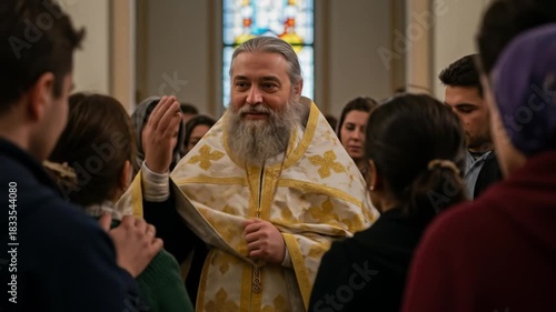 Bearded priest in ornate vestments speaking to a congregation in a church