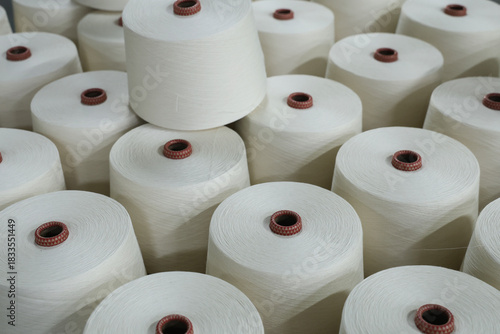 A close-up of a spool of yarn inside the factory