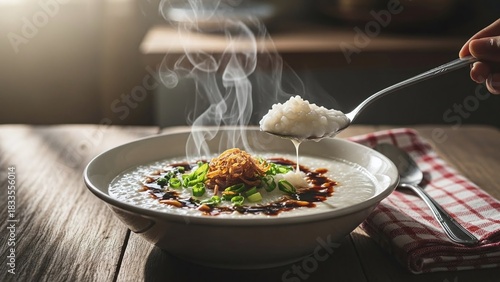 Fototapeta Naklejka Na Ścianę i Meble -  Warm, comforting congee breakfast with savory toppings, steaming on a rustic wooden table, evokes cozy mornings and delicious Asian cuisine experiences