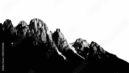 Dramatic Black and White Mountain Peaks Silhouette Against a Bright Sky.