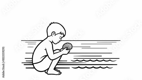 Young boy carefully examines a seashell with intense focus and curiosity.