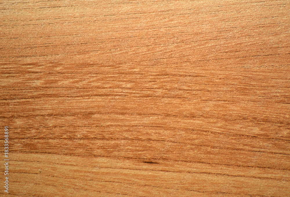 Naklejka premium Light cherry, a natural wood with a distinctive wavy grain, close-up.