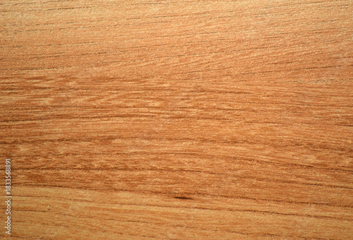 Light cherry, a natural wood with a distinctive wavy grain, close-up.