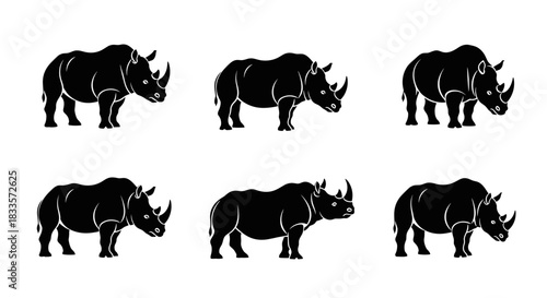 Set of Six Black Rhinoceros Silhouettes Standing Side View.