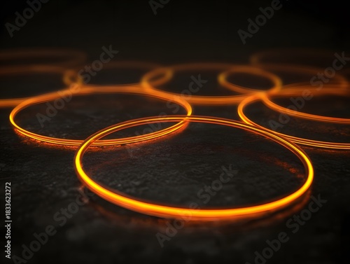 Vibrant orange rings on dark surface, central glow clean for text