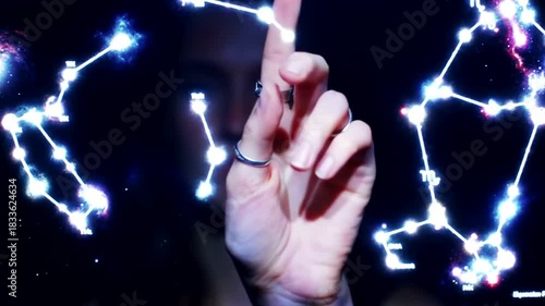 Cosmic Touch - A Hand Interacting with Constellations in a Digital Universe.