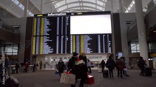 An airport departure board with a blank white information screen. A high-traffic public mockup for travel agencies and global brands.