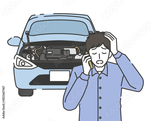 車の故障でロードサービスに電話する男性