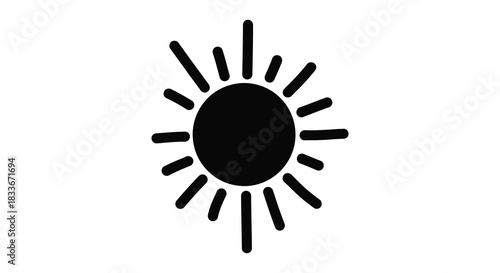 A stark black circle with radiating lines forming a sunburst design a bold silhouette