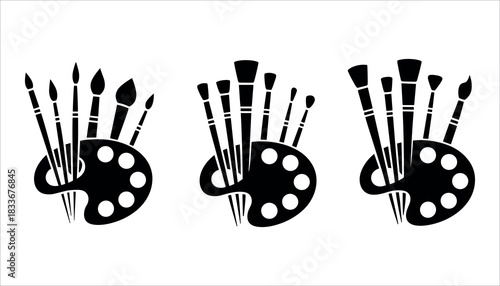 Three black silhouette art palettes with assorted paint brushes artist painting