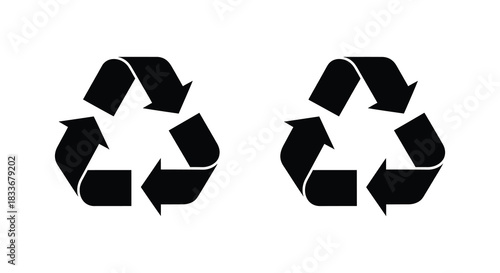 Two black recycling symbols depicted with looping arrows form a recognizable impactful silhouette