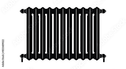 A black cast iron radiator with vertical bars presented in a stark silhouette