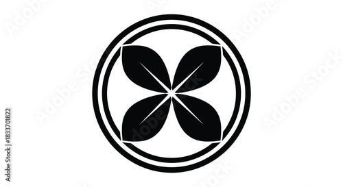 A circular design featuring a floral motif with four petals a striking black silhouette
