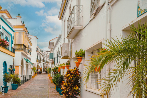 Charming, flower-bedecked street in Estepona, Spain in early  Spring