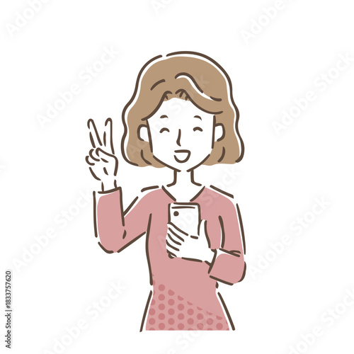 スマホを持ち笑顔でピースして喜んでいる若い女性