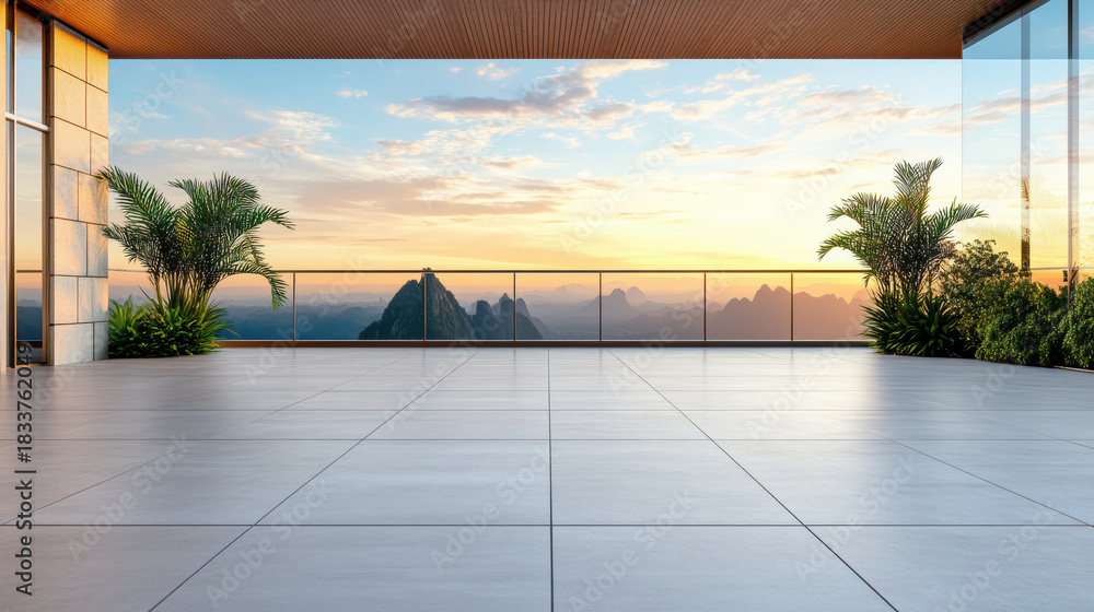Obraz premium Spacious rooftop terrace with sunset mountain view and tropical plants, serene atmosphere