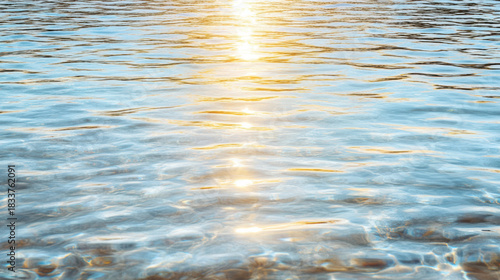 Fototapeta Naklejka Na Ścianę i Meble -  Golden light water reflection on calm sea at sunset