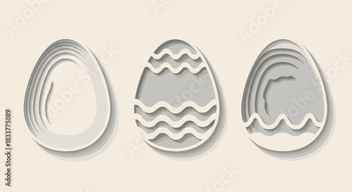 Set of three decorative Easter eggs with different patterns in a modern and minimalist gray 3D paper cut out craft style.