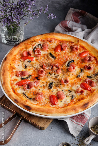 Woodstone-style pizza with mushrooms and cherry tomatoes