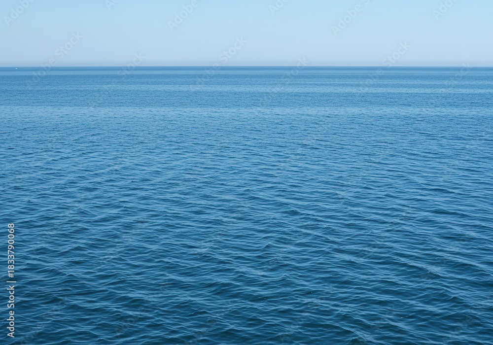 Obraz premium Vast, tranquil saltwater surface shimmering with gentle ripples under natural light. The expansive blue liquid creates a serene and pure natural background ,texture ,surface ,light