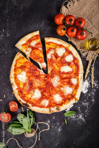 Cozy Italian kitchen with freshly baked margherita pizza details