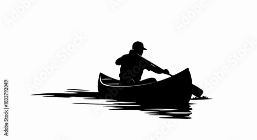 Silhouette of a person paddling a canoe on the water during daytime.