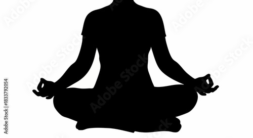 Silhouette of a person sitting in a yoga meditation pose.