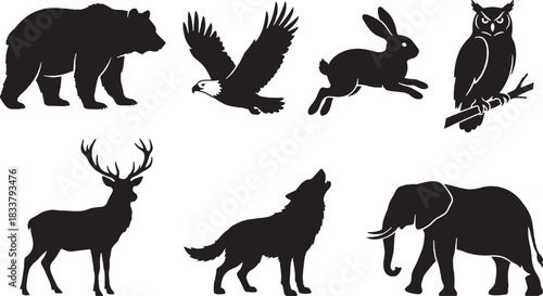 Silhouettes of wild animals including a bear deer wolf and soaring eagle