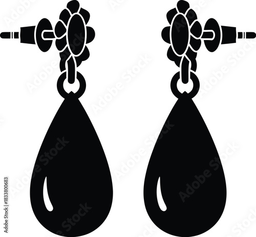 A pair of black teardrop earrings with intricate detailing shown in silhouette