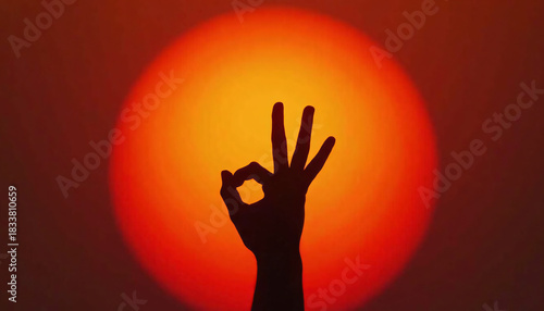 Wallpaper Mural Hand Gesturing Okay Against Blurred Orange Circle Torontodigital.ca