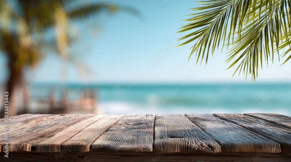 Obraz premium A wooden table with a view of the ocean. The table is empty and the ocean is blue