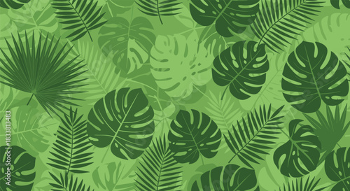 Tropical palm leaves and monstera foliage pattern in various shades of green.