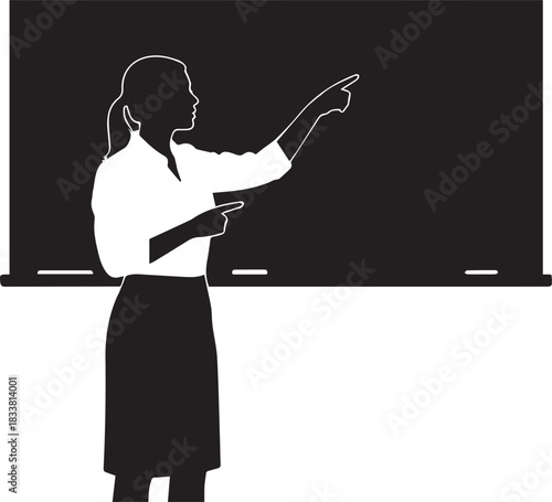 Silhouette of a teacher pointing at a blackboard in a classroom