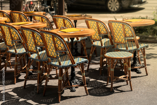 Paris France empty cafe patio chairs on downtown city sidewalk