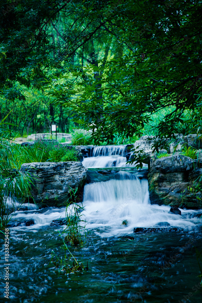 Naklejka premium Greenery and stream