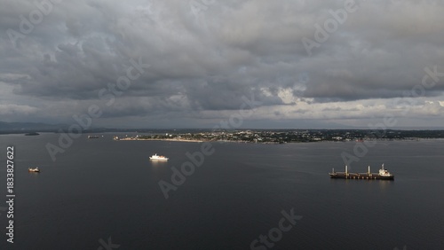 Puerto Princesa city coast view with cargo ships from sea Palawan