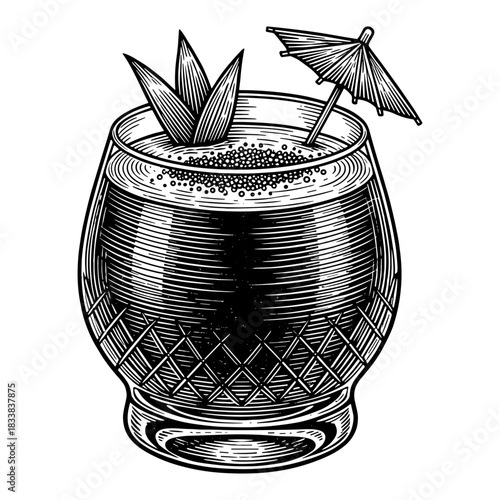 Tropical cocktail with umbrella and pineapple leaves