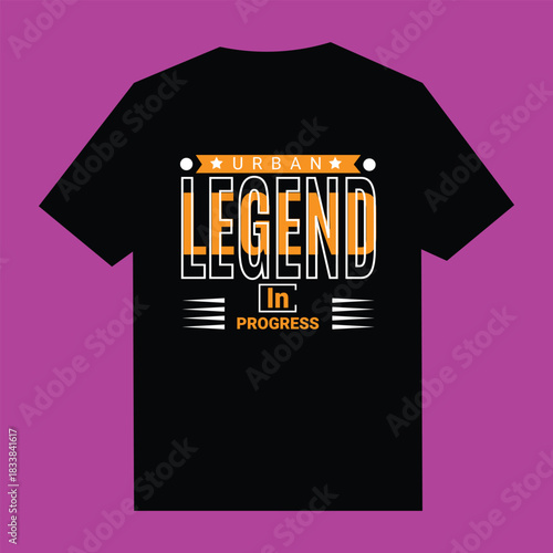 Black t shirt with orange and white text urban legend in progress 1
