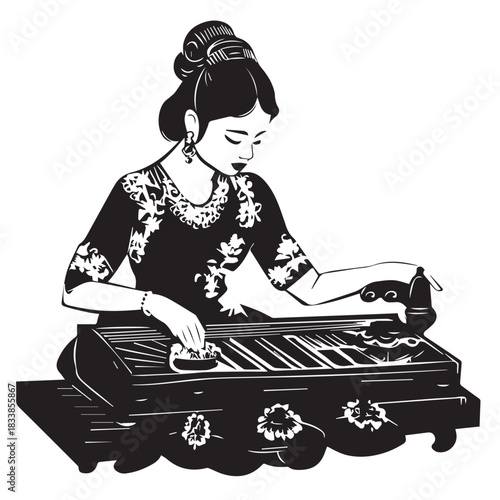 woman sitting playing traditional musical instruments