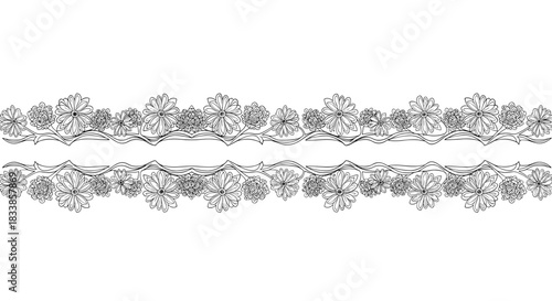 A delicate and seamless black and white horizontal border made of intricate snowflakes and floral-style winter elements.