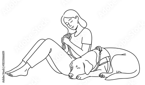 Woman petting sleeping dog on floor