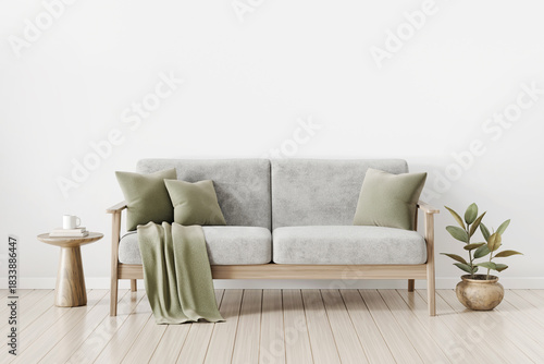 White living room interior with gray sofa, green pillows, plaid, side table and house plant. Modern minimal home decoration.  Empty wall background with free copy space above. 3D render.