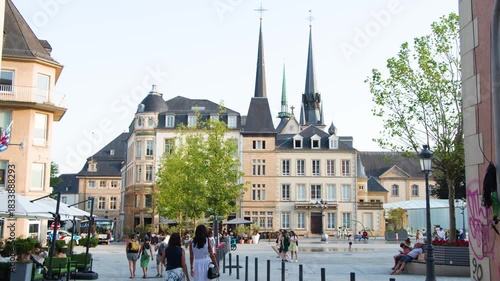 People Walking in Historic Luxembourg City Square at Dusk