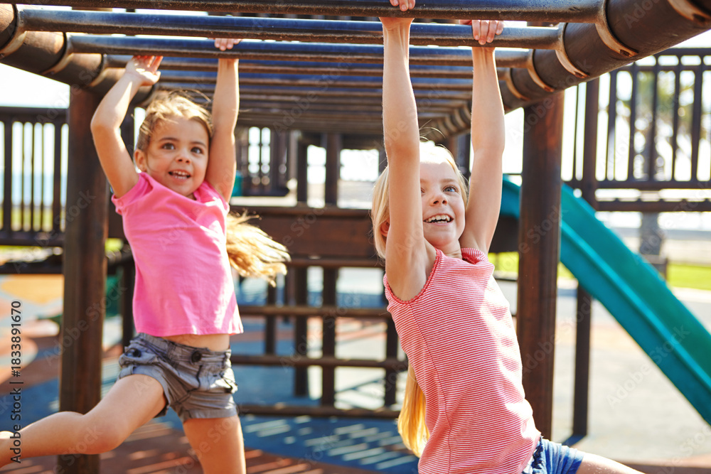Fototapeta premium Playground, happy and kids in park on bars for playing games, having fun and bonding outdoor. Sisters, family and girls climbing for playful activity on holiday, adventure and weekend together
